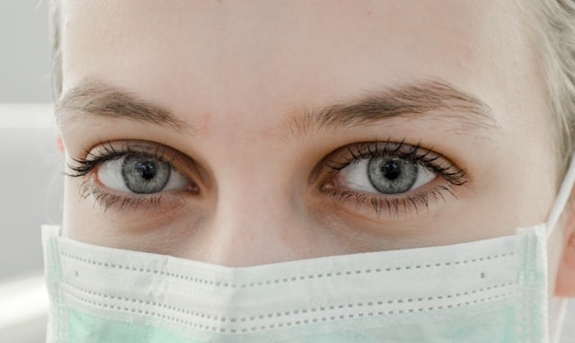 woman in a disposable surgical mask