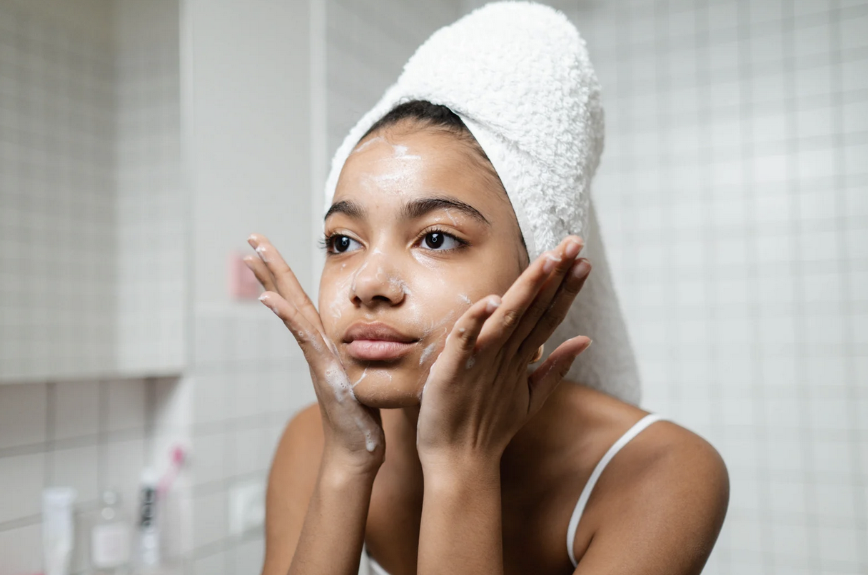 woman washing her face