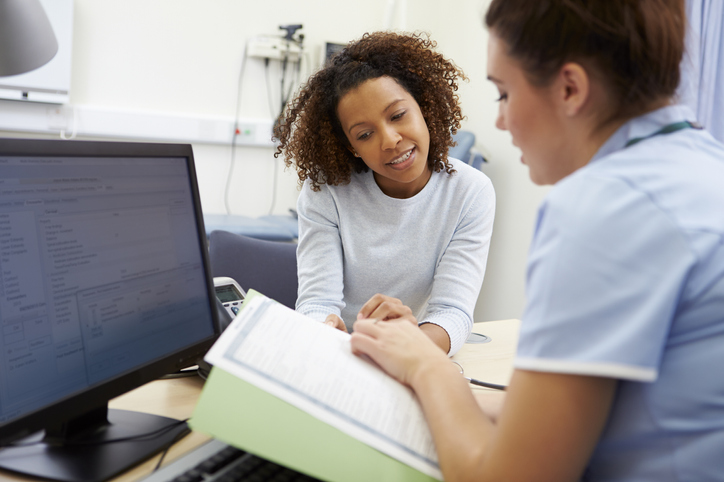 woman consulting with a rheumatologist