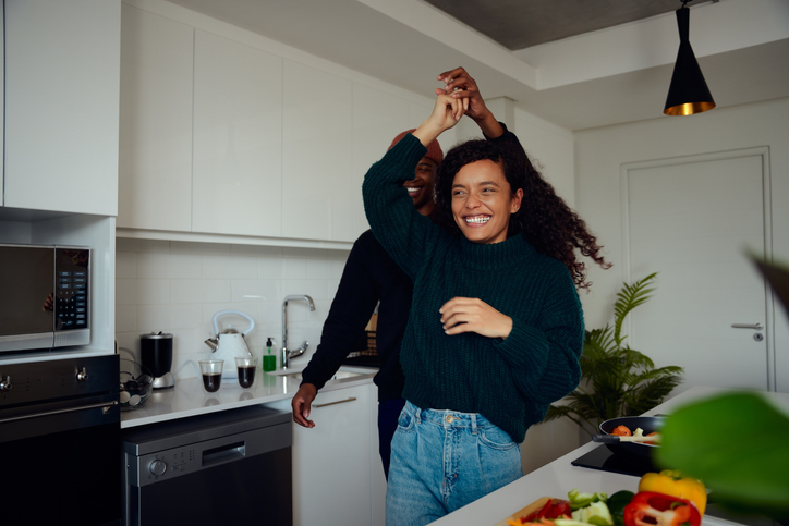 couple dancing in their kitchen