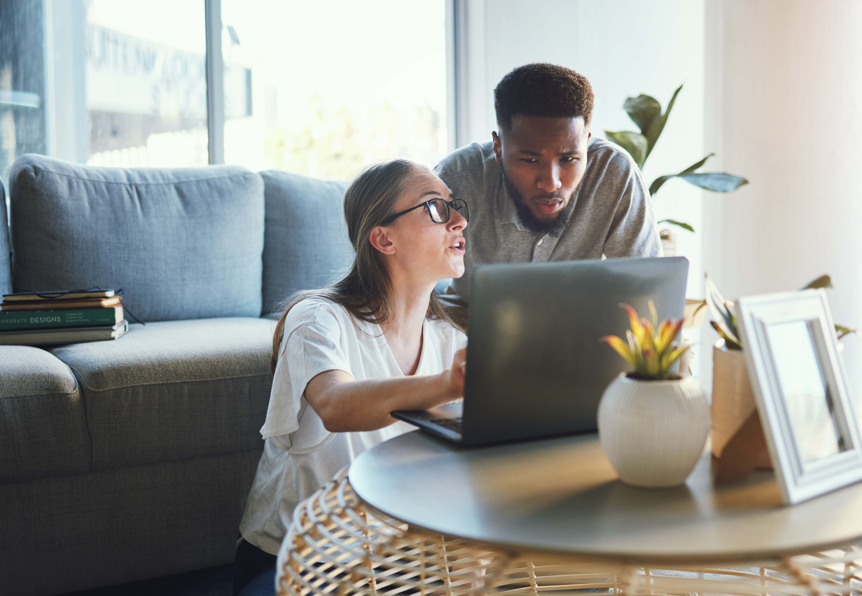 couple researching adoption grants