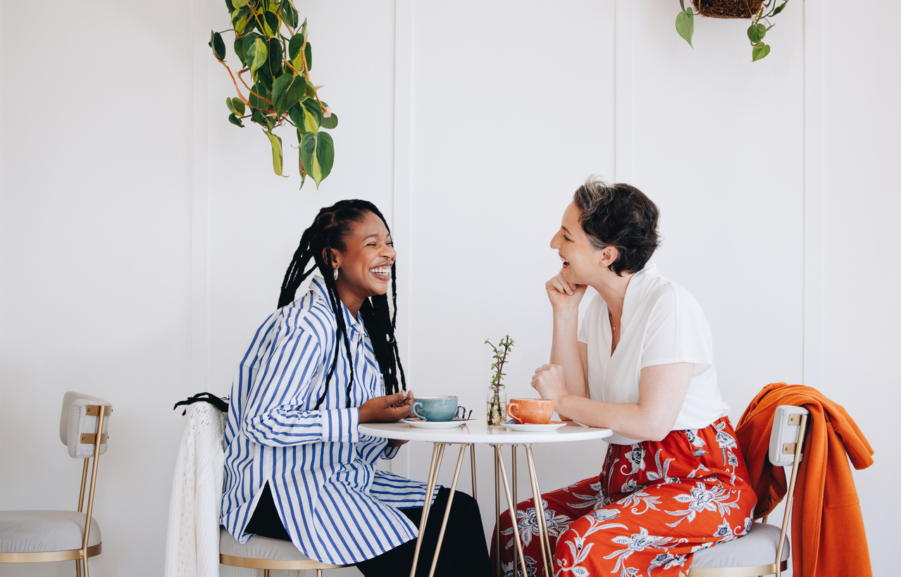 two women chatting over coffee