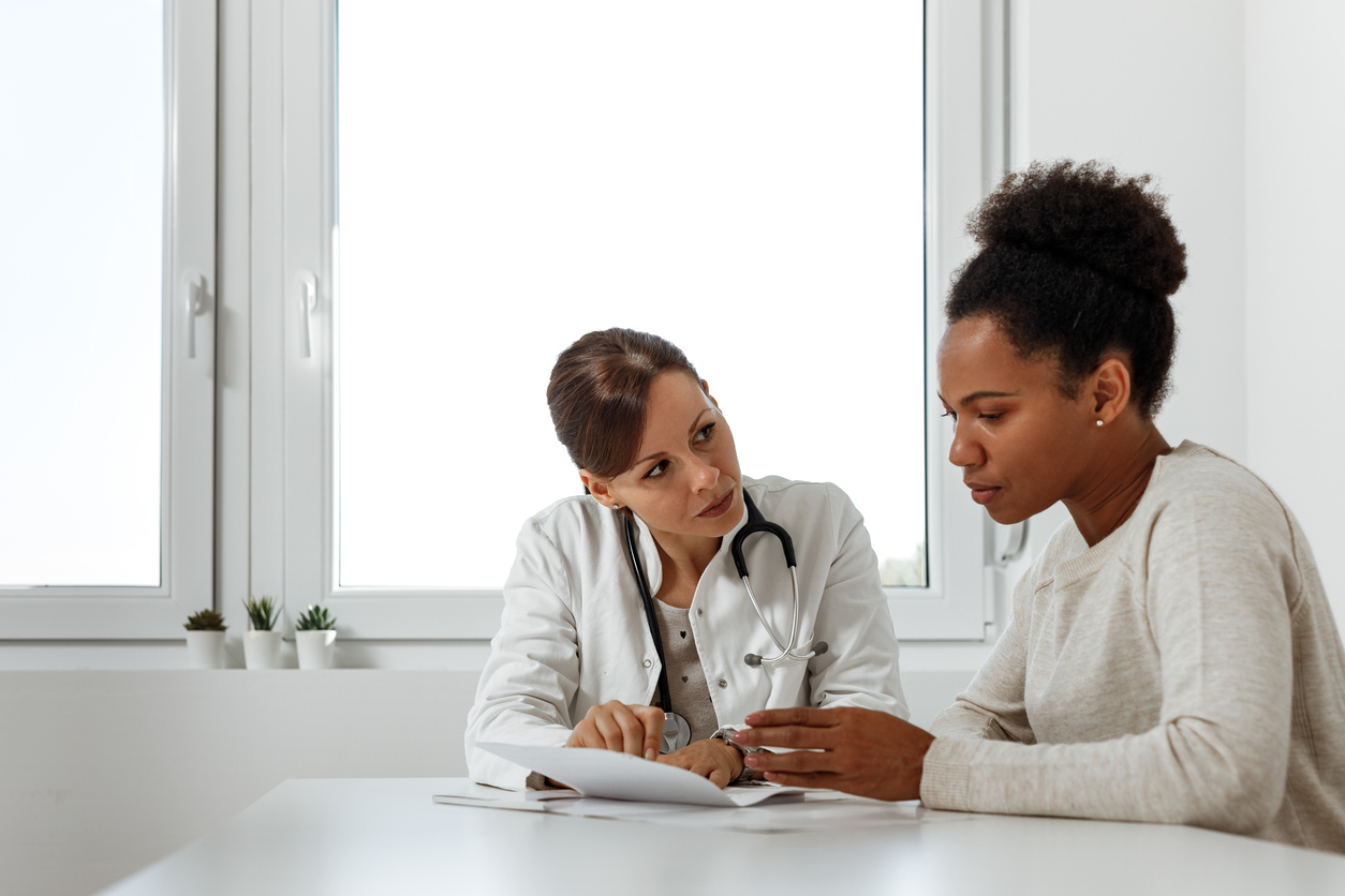 doctor consulting with miscarriage patient