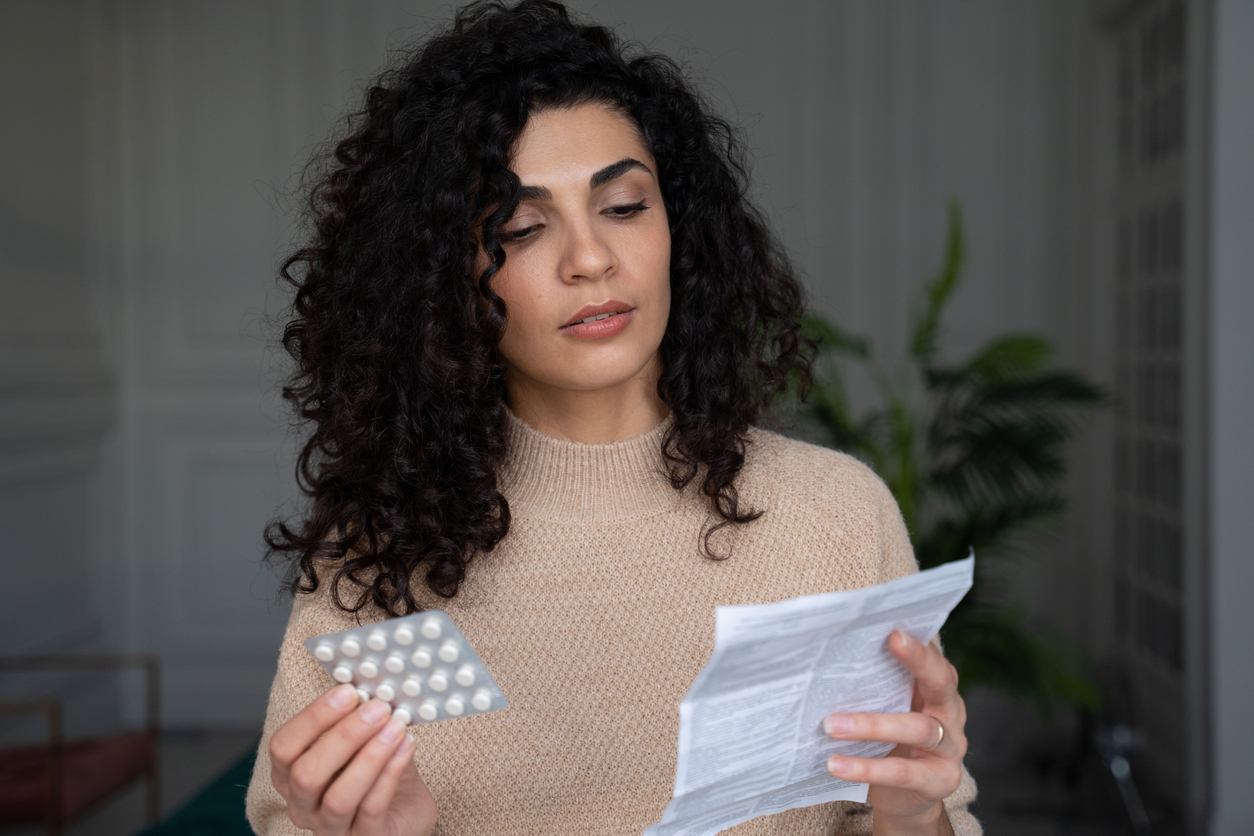 woman reading clomid prescription directions