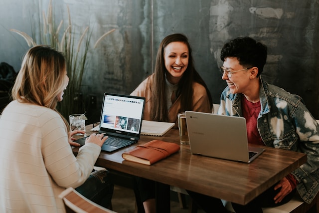 group of coworkers working around a table