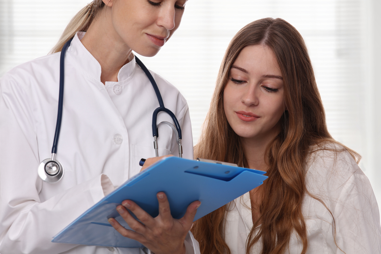 woman discussing sti results with doctor