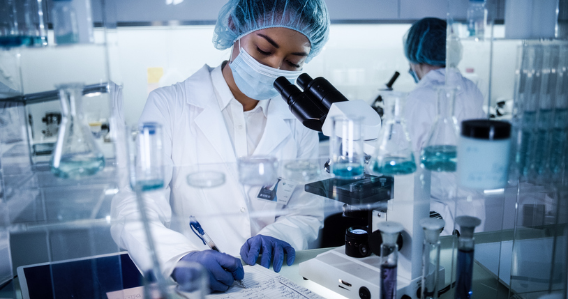 lab technician writing notes about a patient's pgt-a test