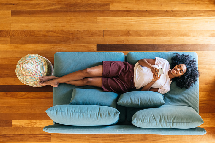 woman relaxing on her sofa