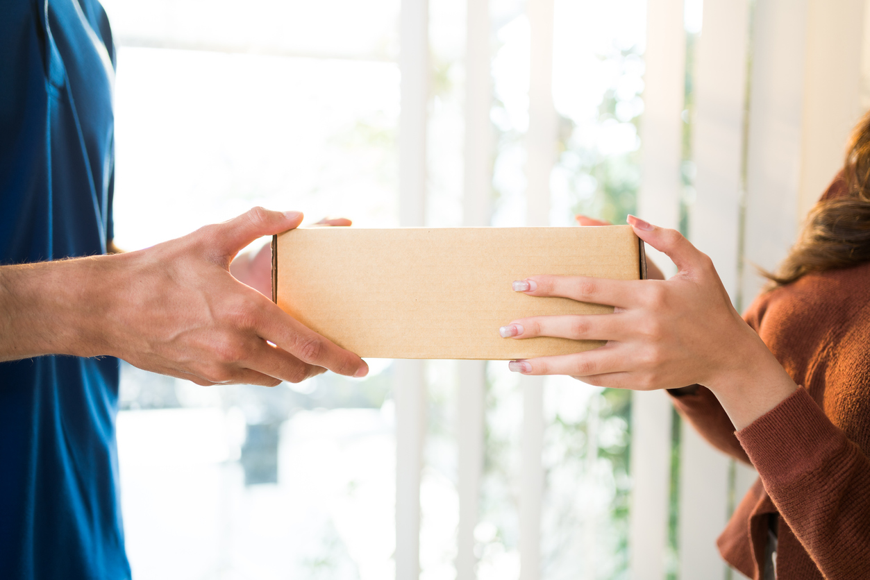 couple grabbing a fertility testing box