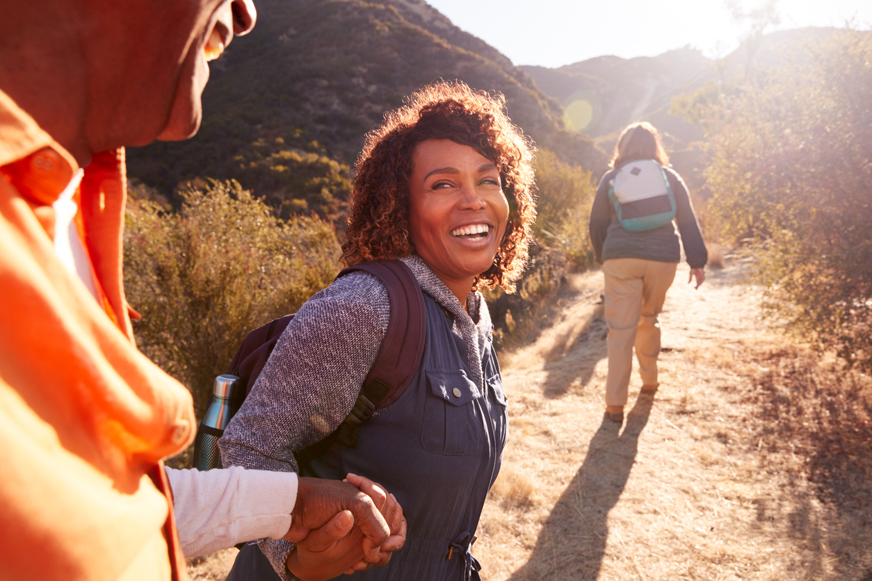 black woman hiking with friends