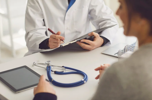 woman in consultation with her doctor