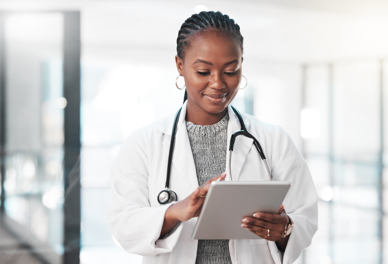 doctor looking at a tablet