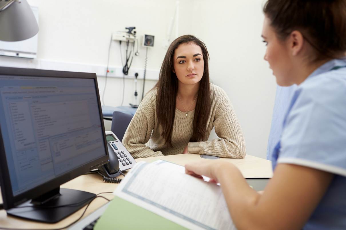 doctor interviewing patient during a fertility health assessment