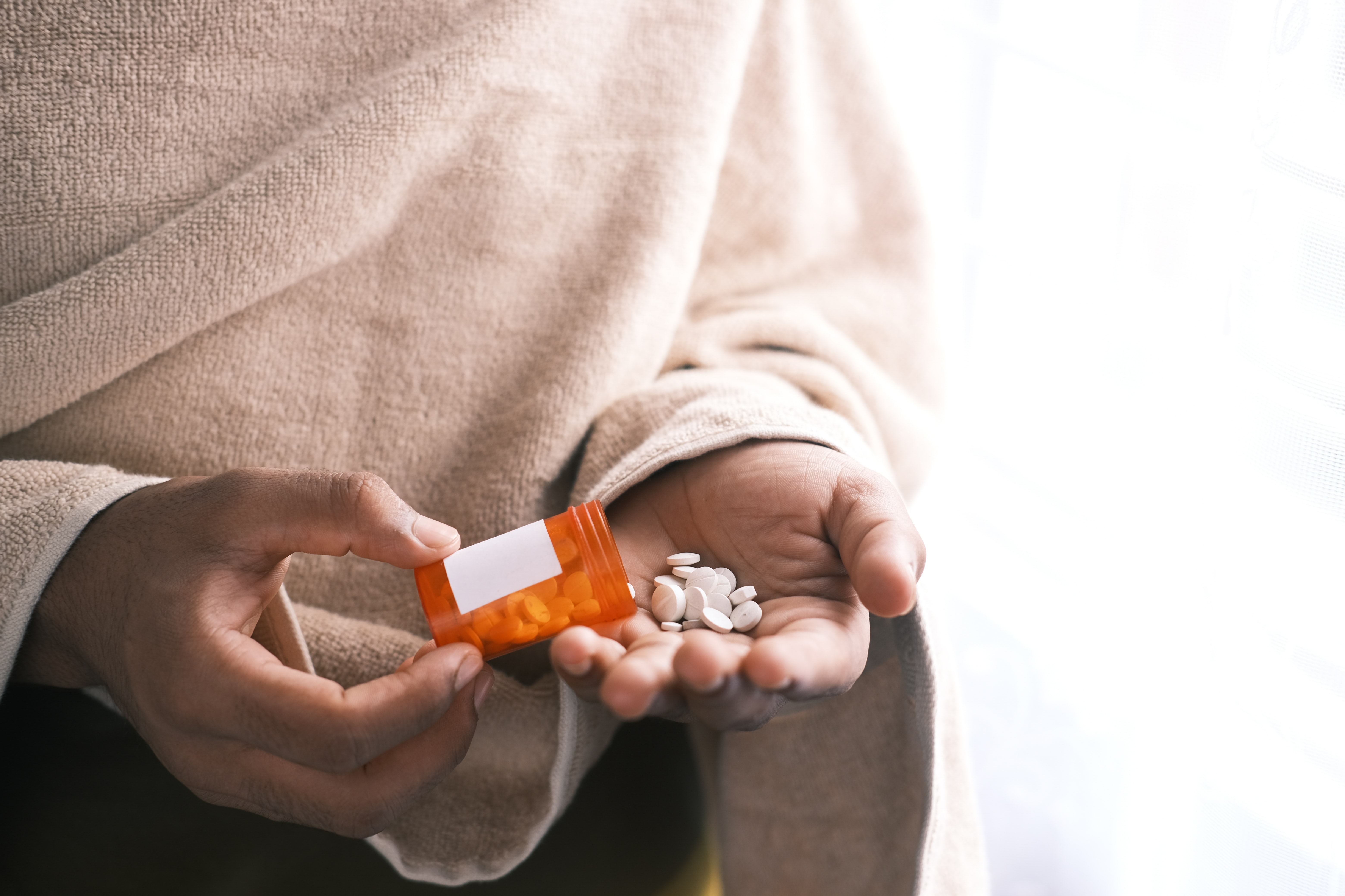 woman taking medication for a vaginal infection