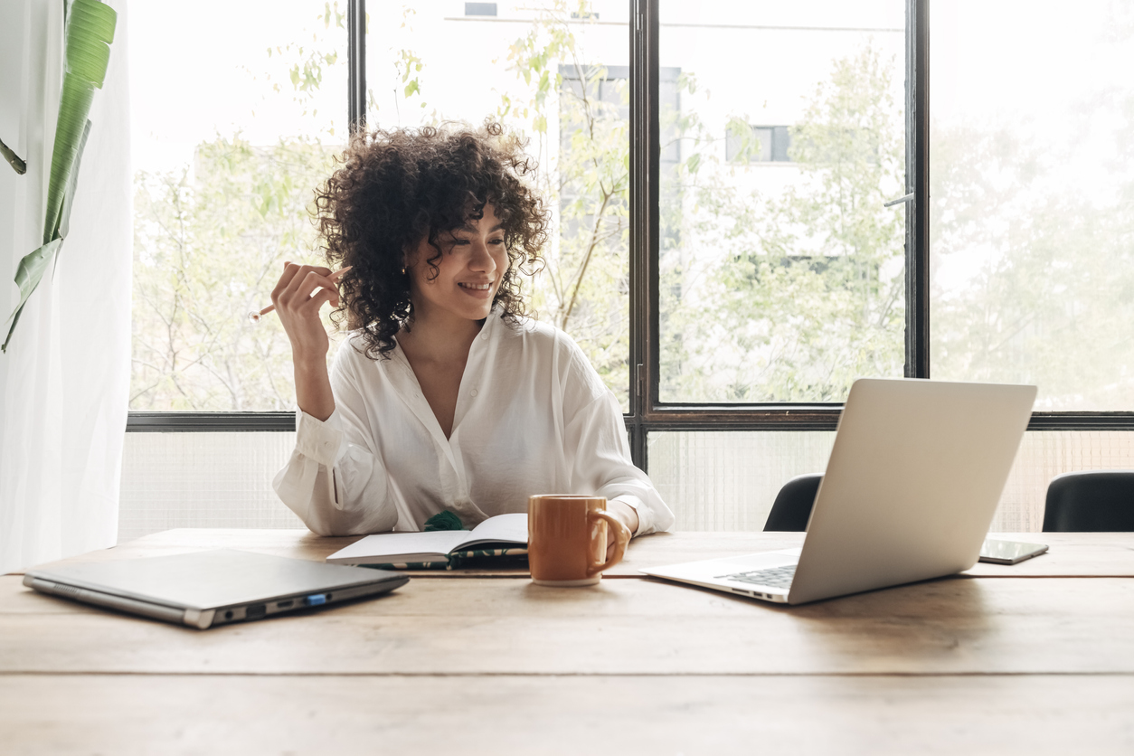 black woman working at her laptop