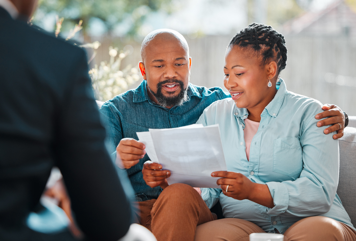 couple reading genetic information about egg donor