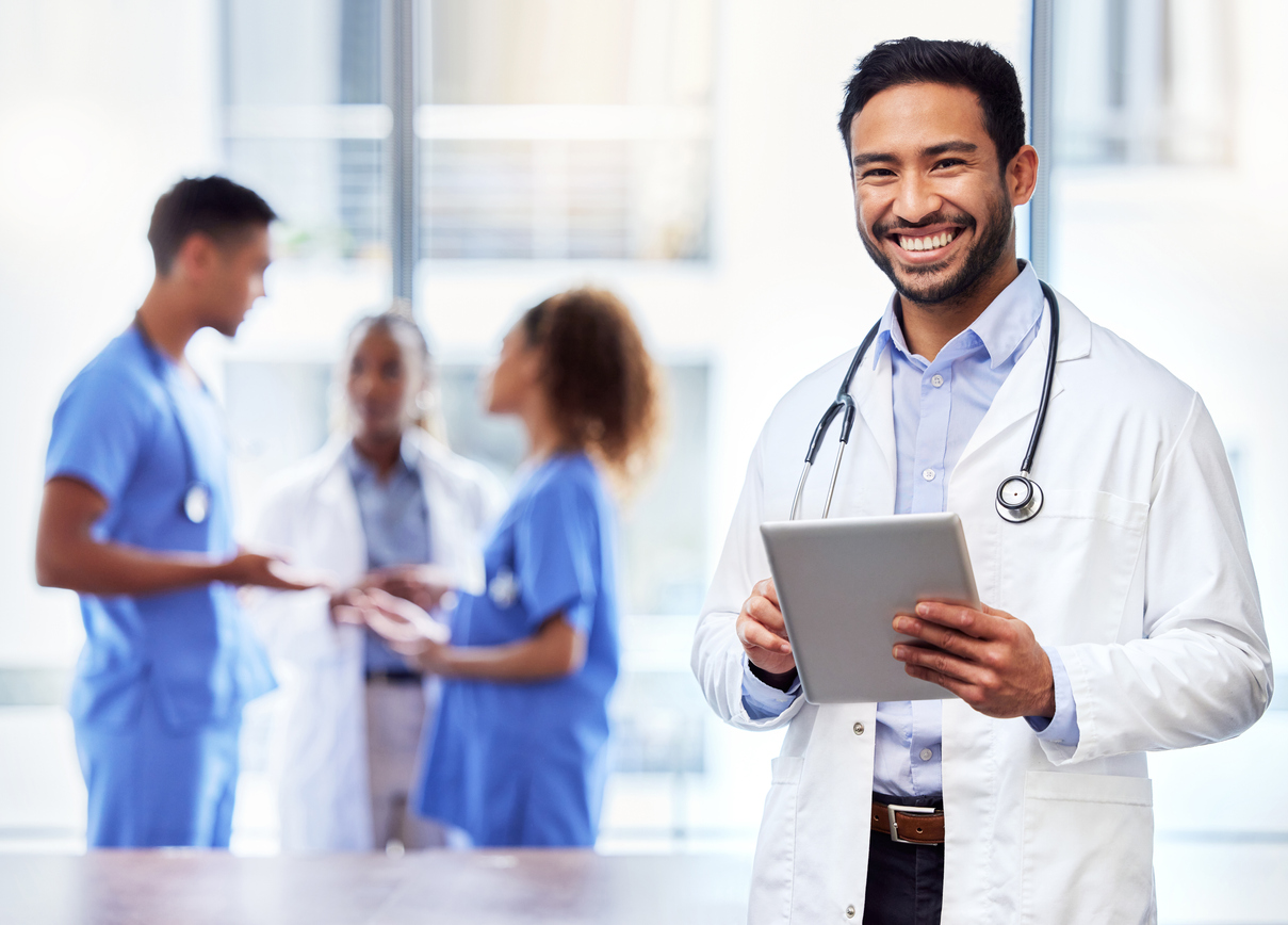 doctor in lab coat smiling