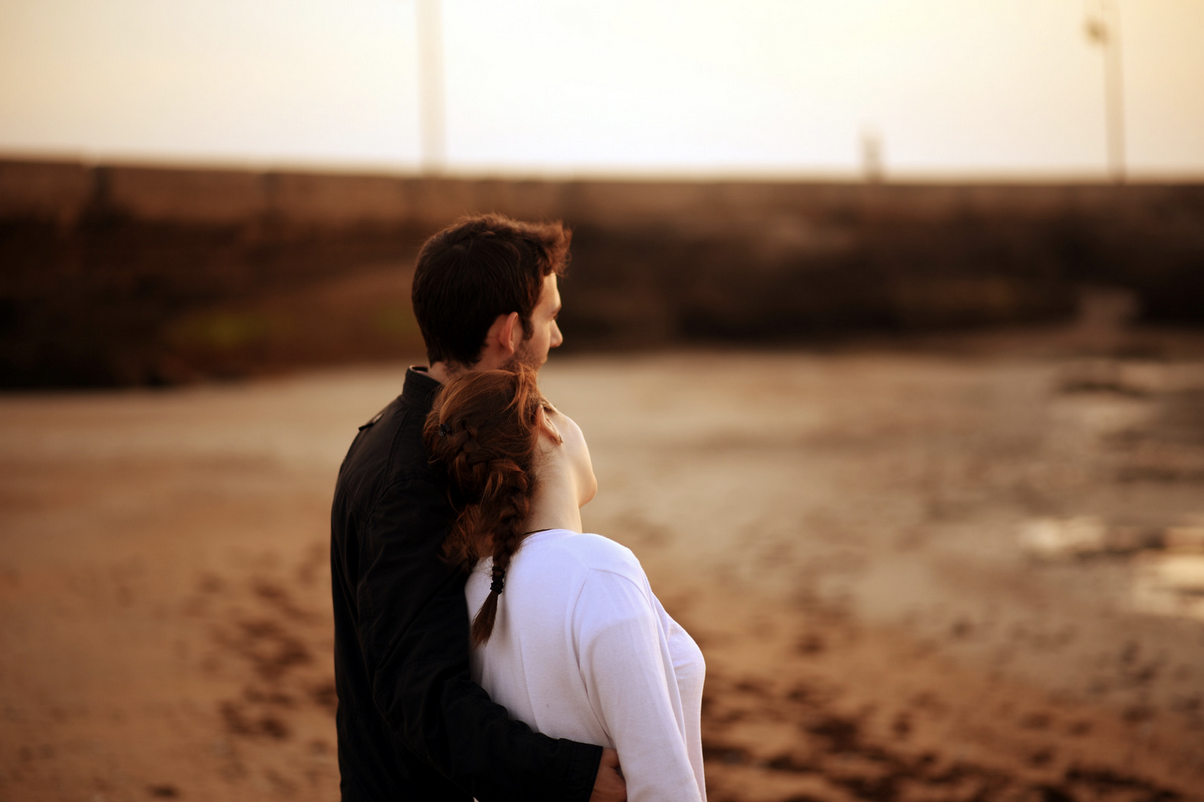 couple at the beach during sunset