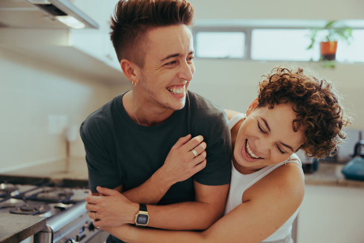 couple being playful in the kitchen