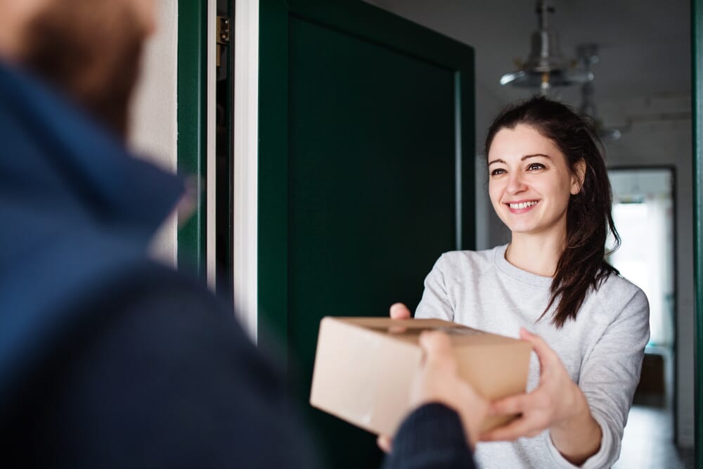 woman receiving her fertility pharmacy next day air shipment