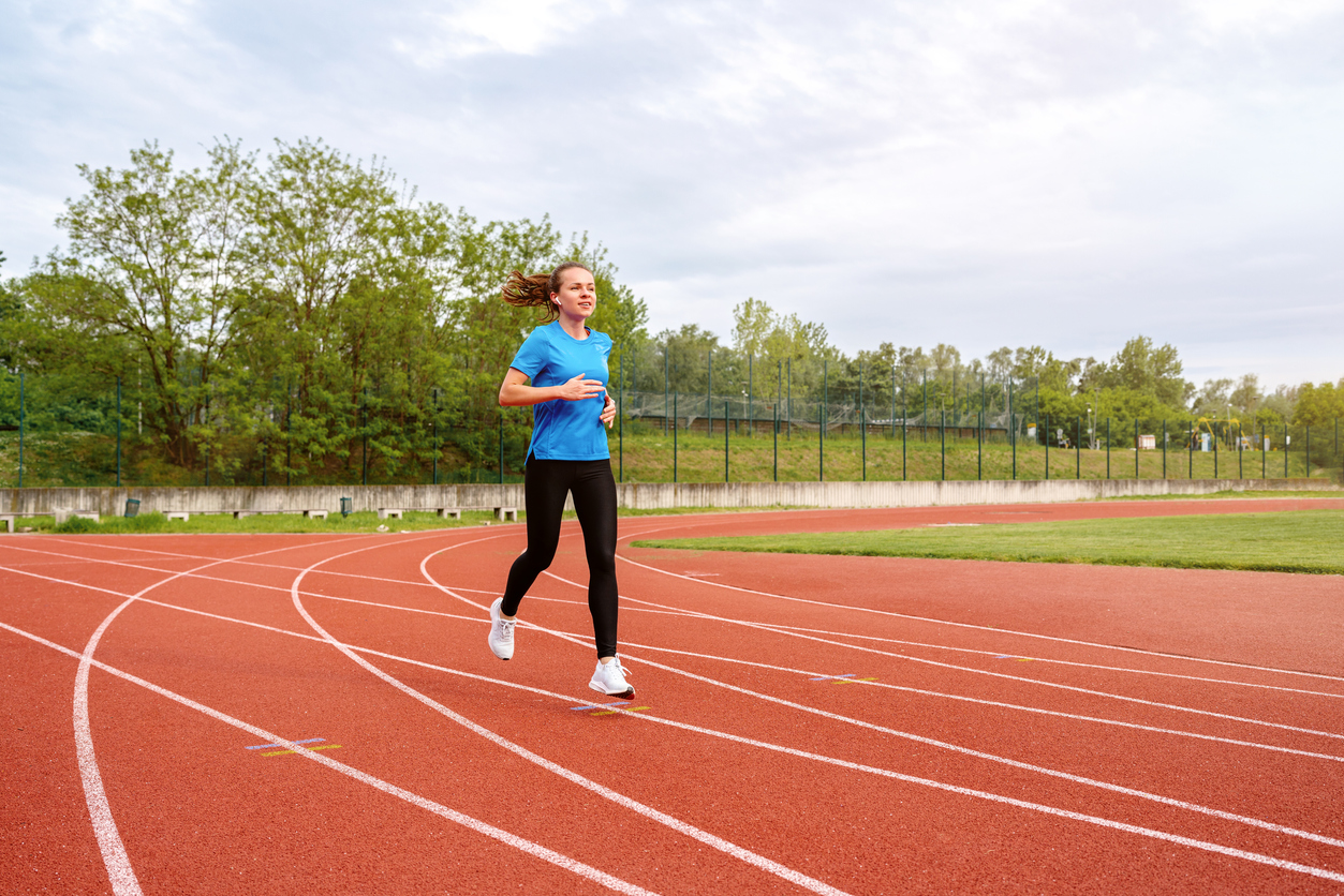 woman running on a track