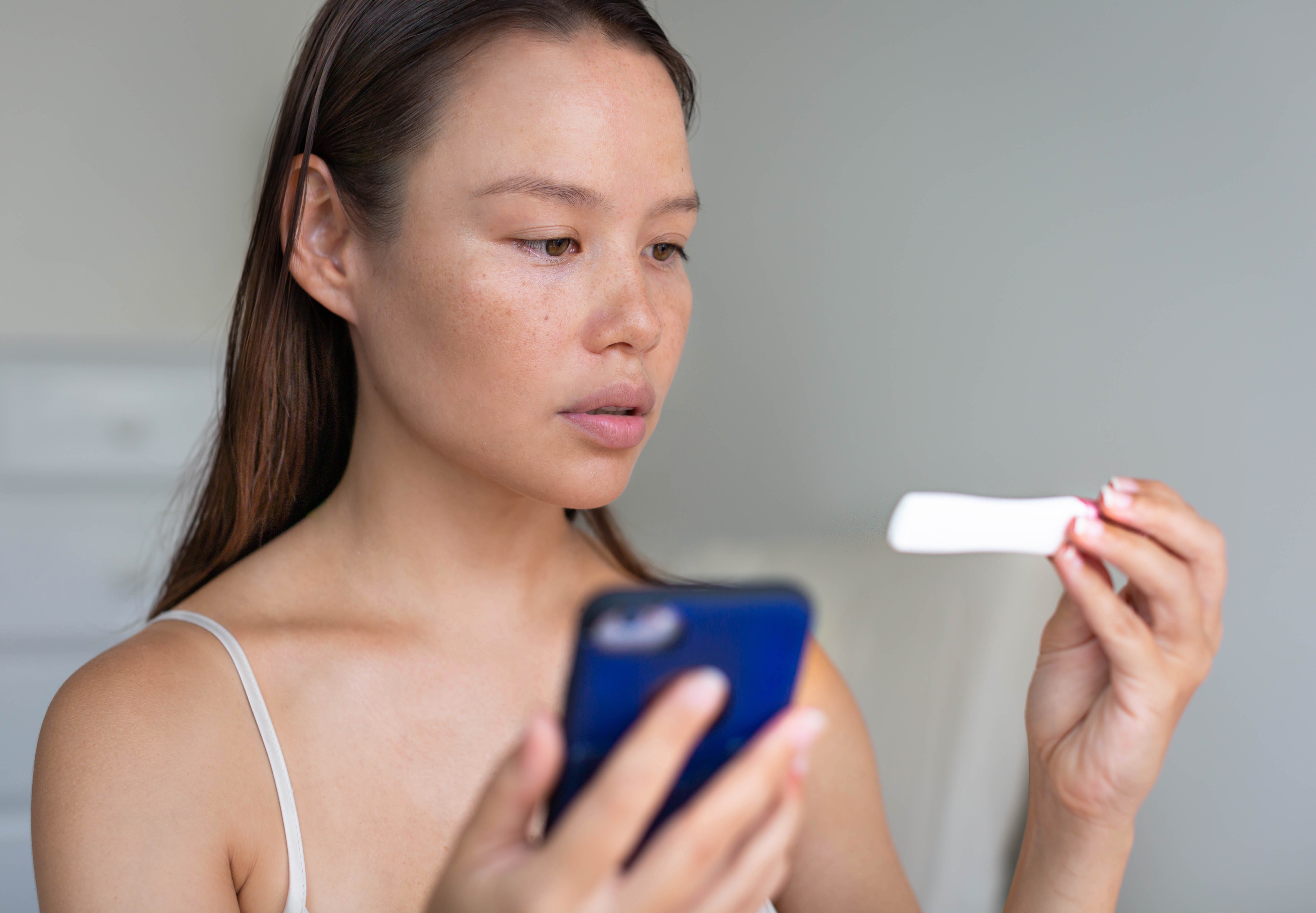 woman tracking her ovulation with an app