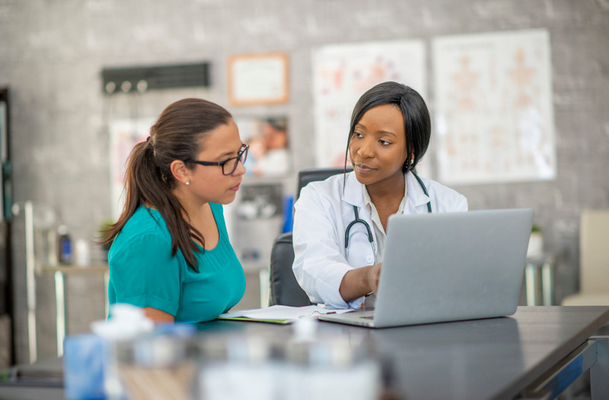 fertility specialist consulting with a patient