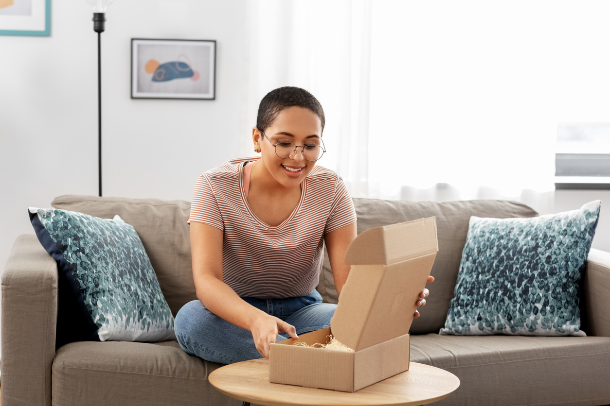 woman unboxing an ovulation tracker