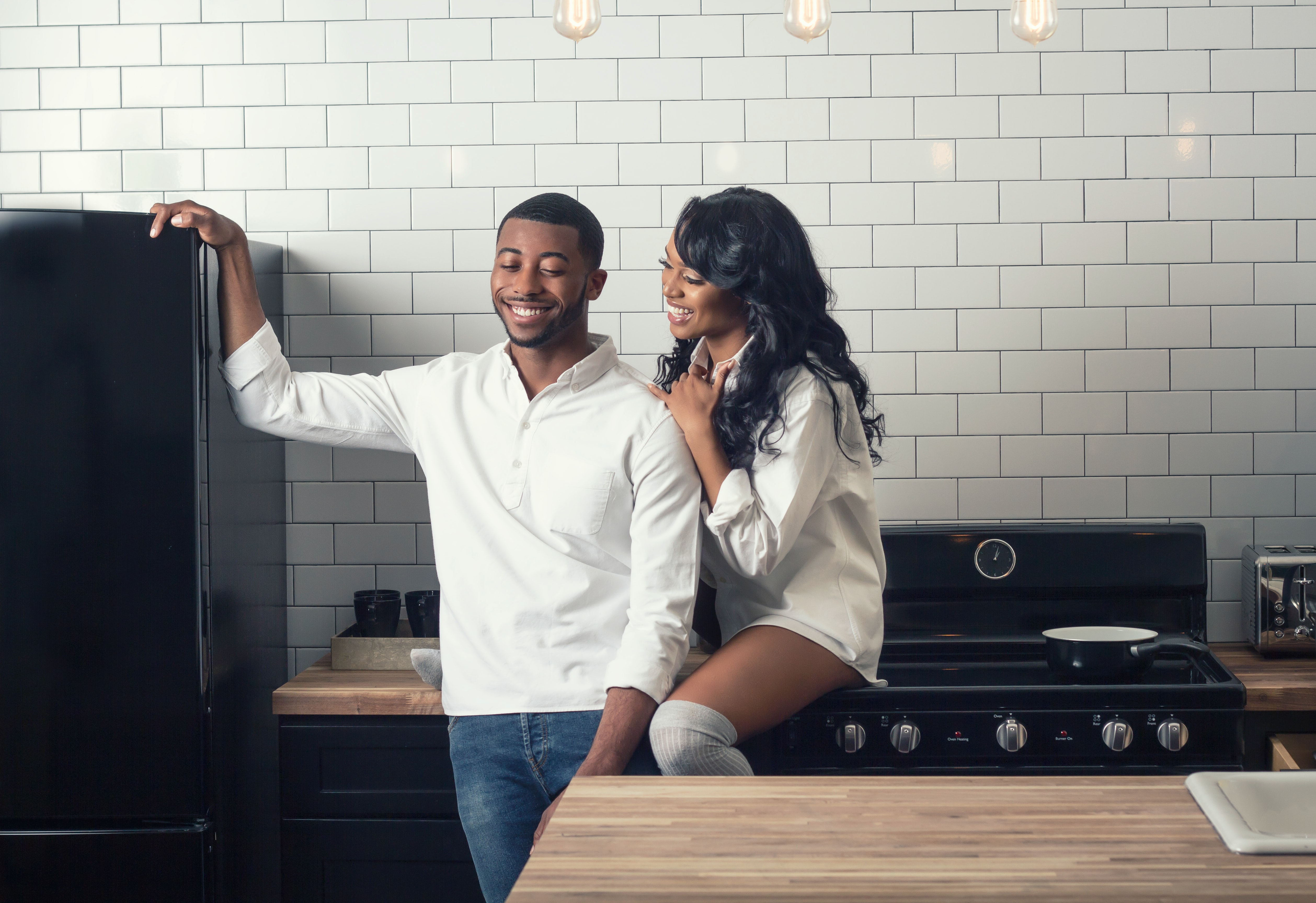 couple flirting in the kitchen