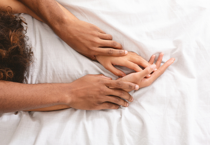 couple embracing in bed