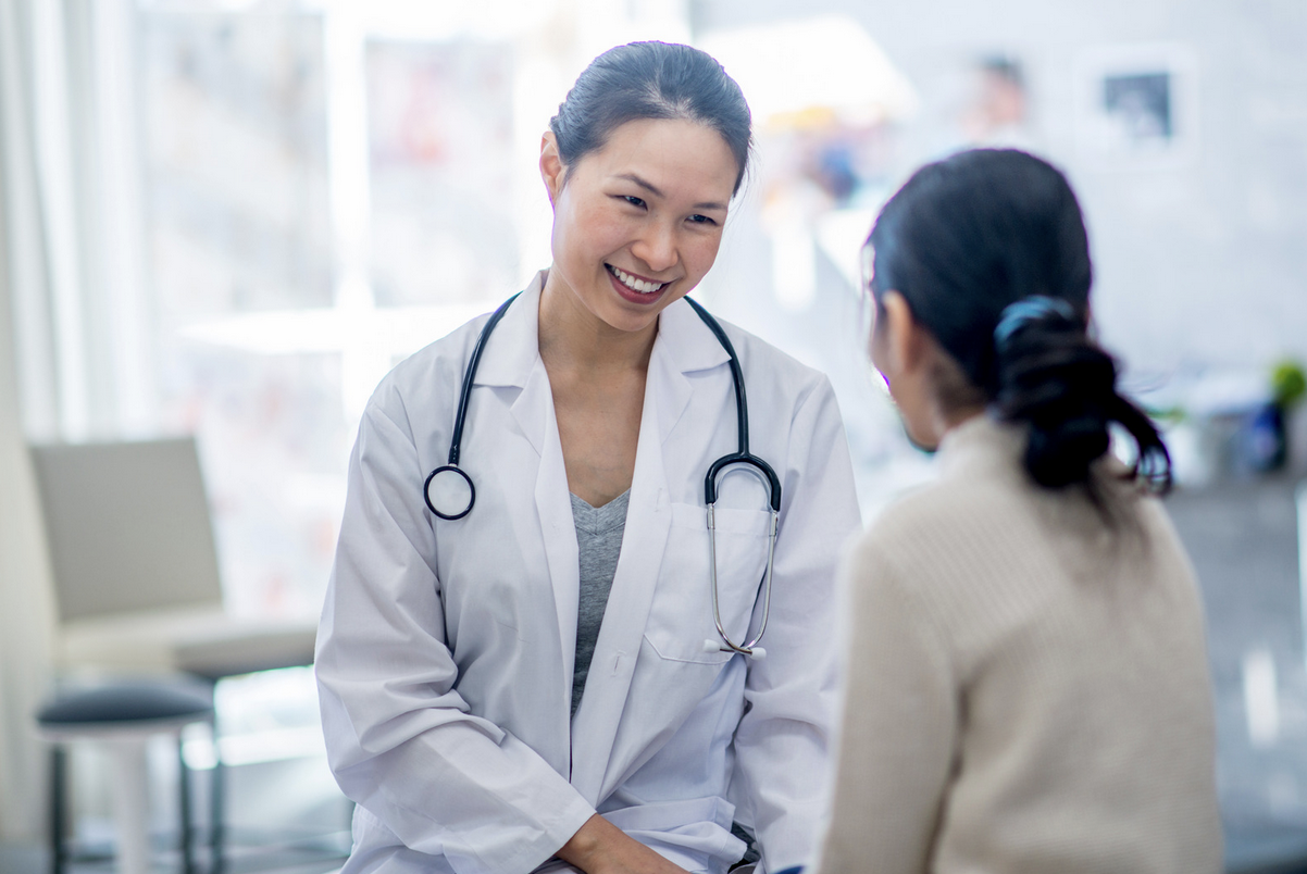 woman meeting with fertility specialist