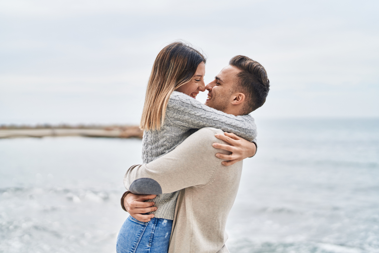 man lifting a woman in an embrace