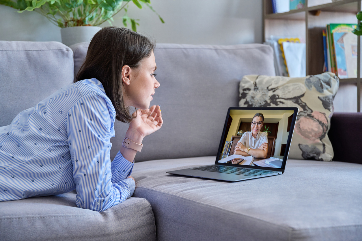 woman doing online cognitive behavioral therapy in her home