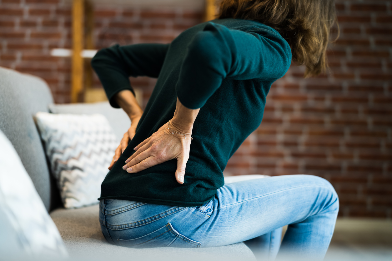 woman with back cramps due to endometriosis flare-up