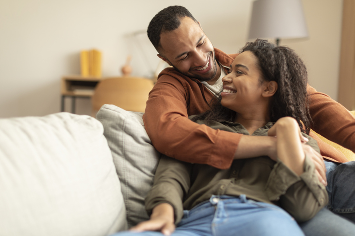 couple cuddling on the couch