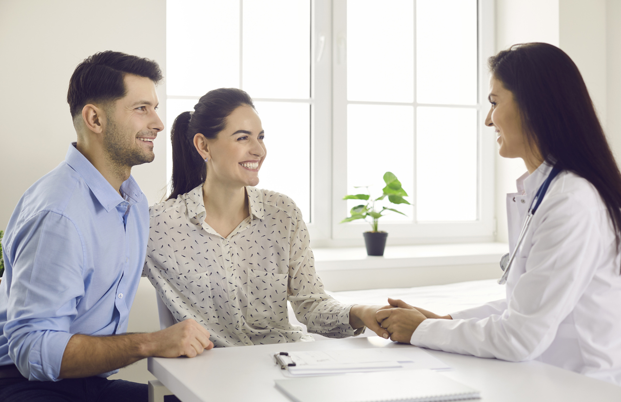 fertility doctor consulting with couple