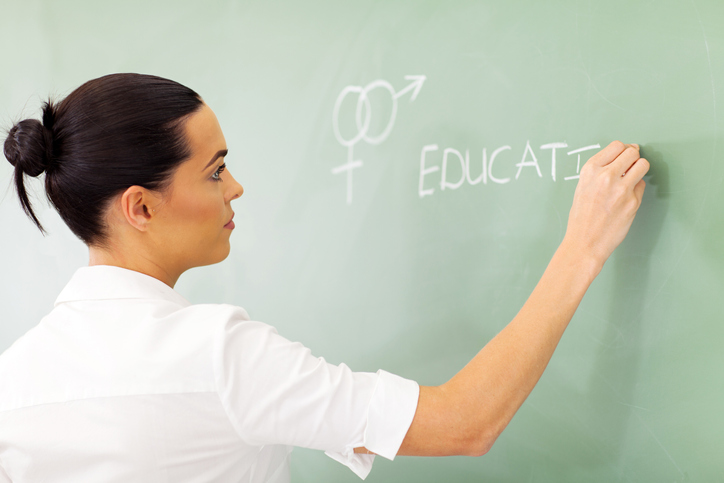 teacher writing about sex on a chalkboard