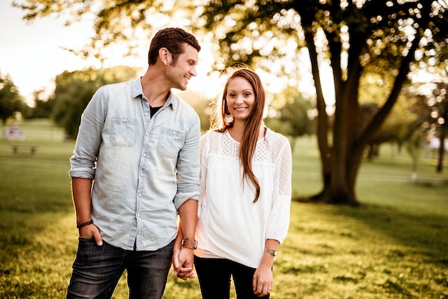 happy couple walking in a park