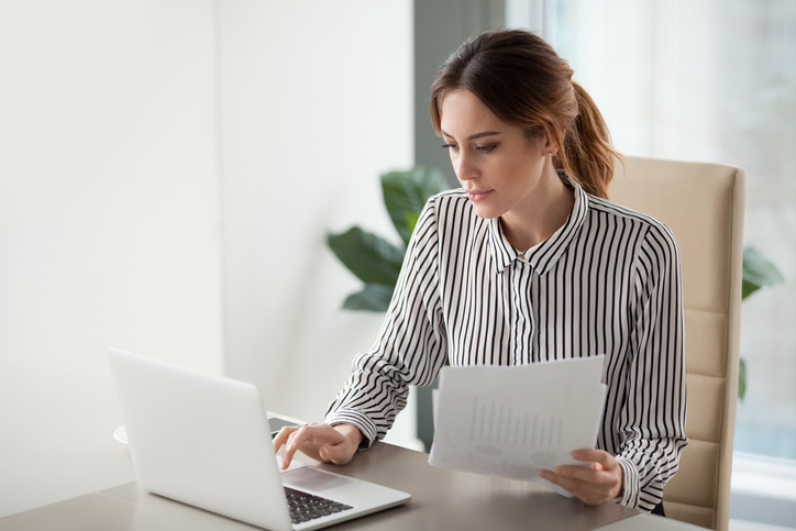 woman researching on her laptop