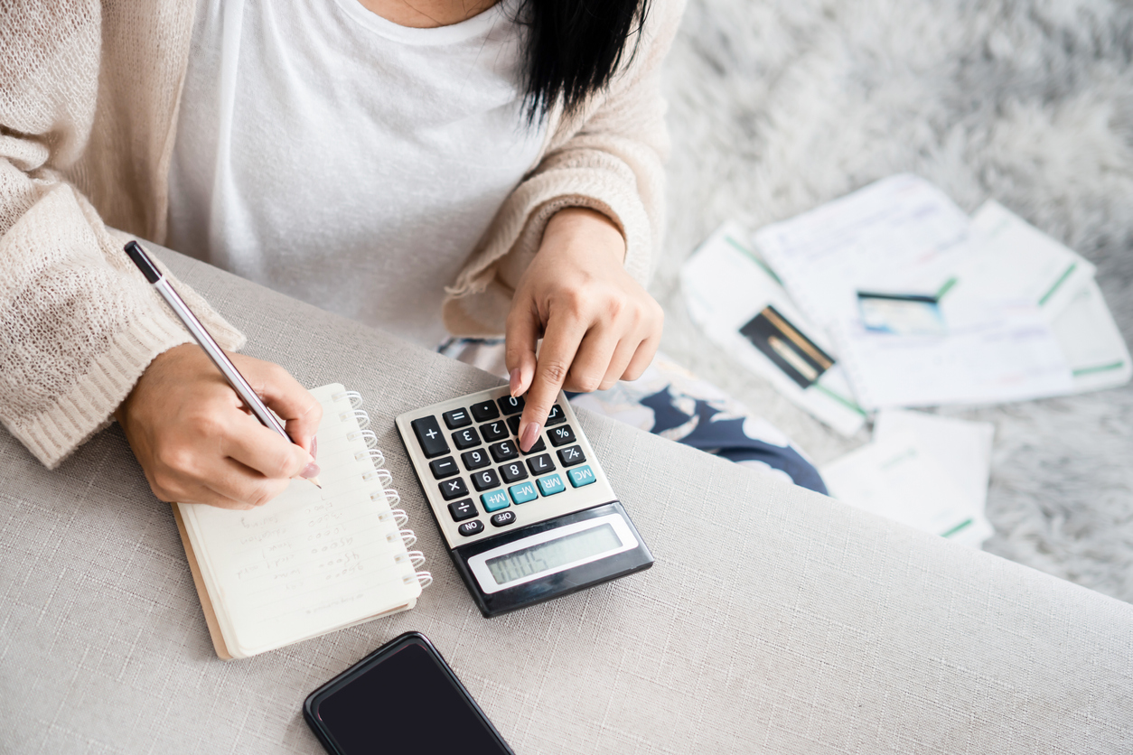 woman calculating cost of egg freezing