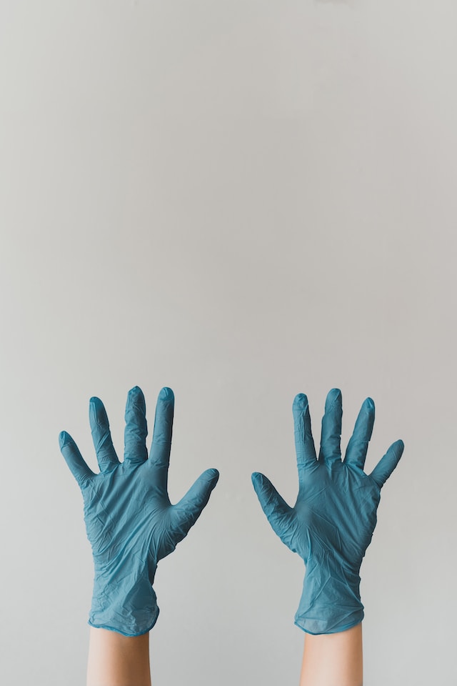 woman with cleaning gloves on