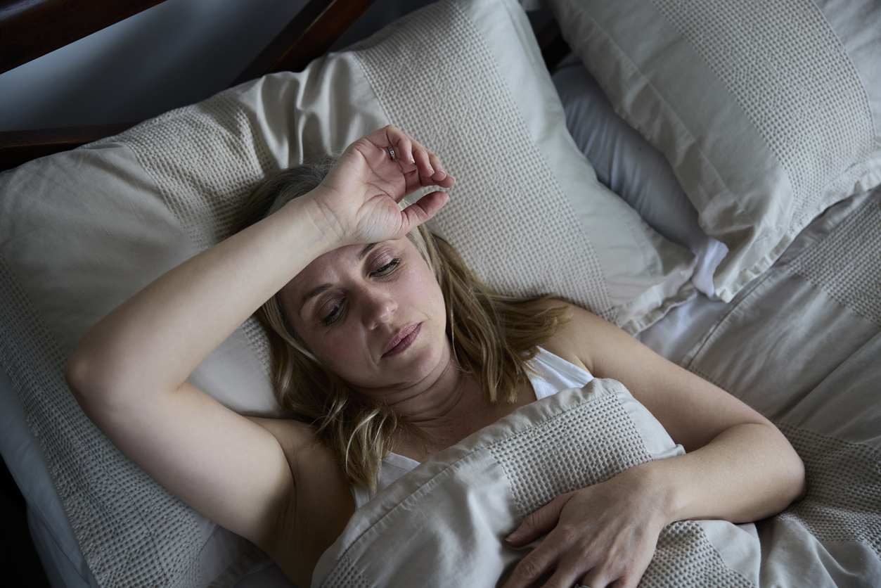 woman suffering from seasonal affective disorder in bed