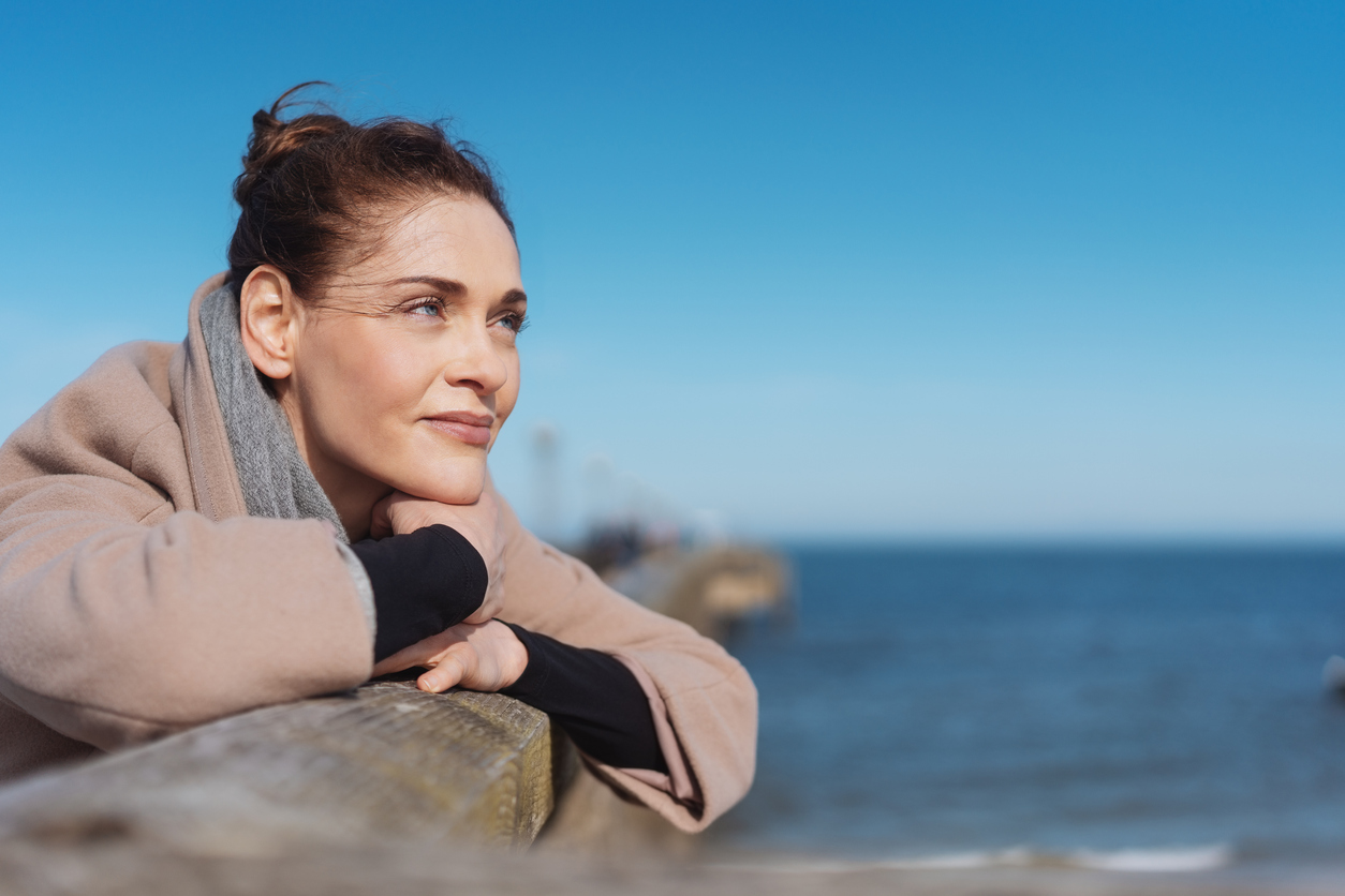 woman enjoying a view of the ocean