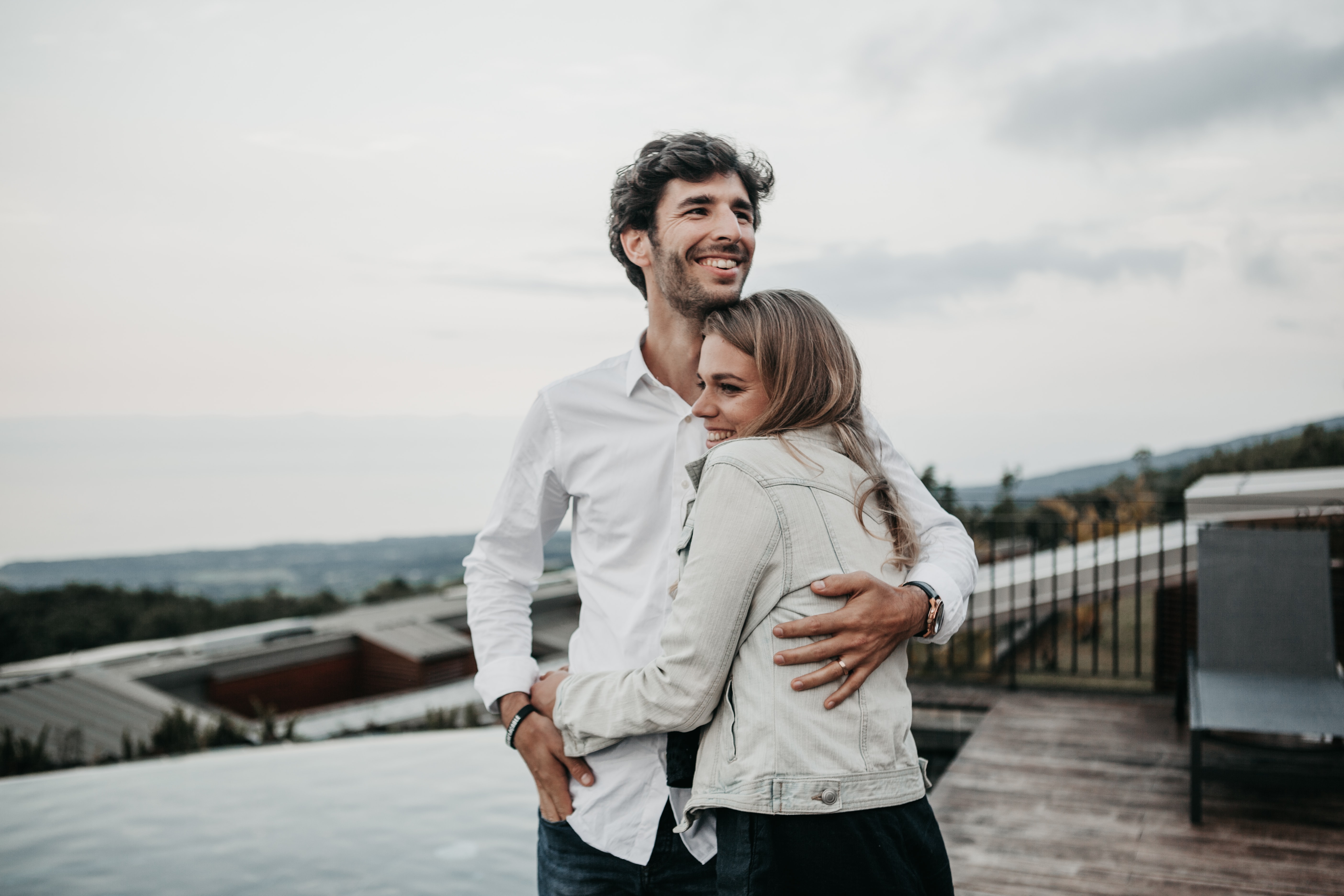 couple embracing on a roof deck