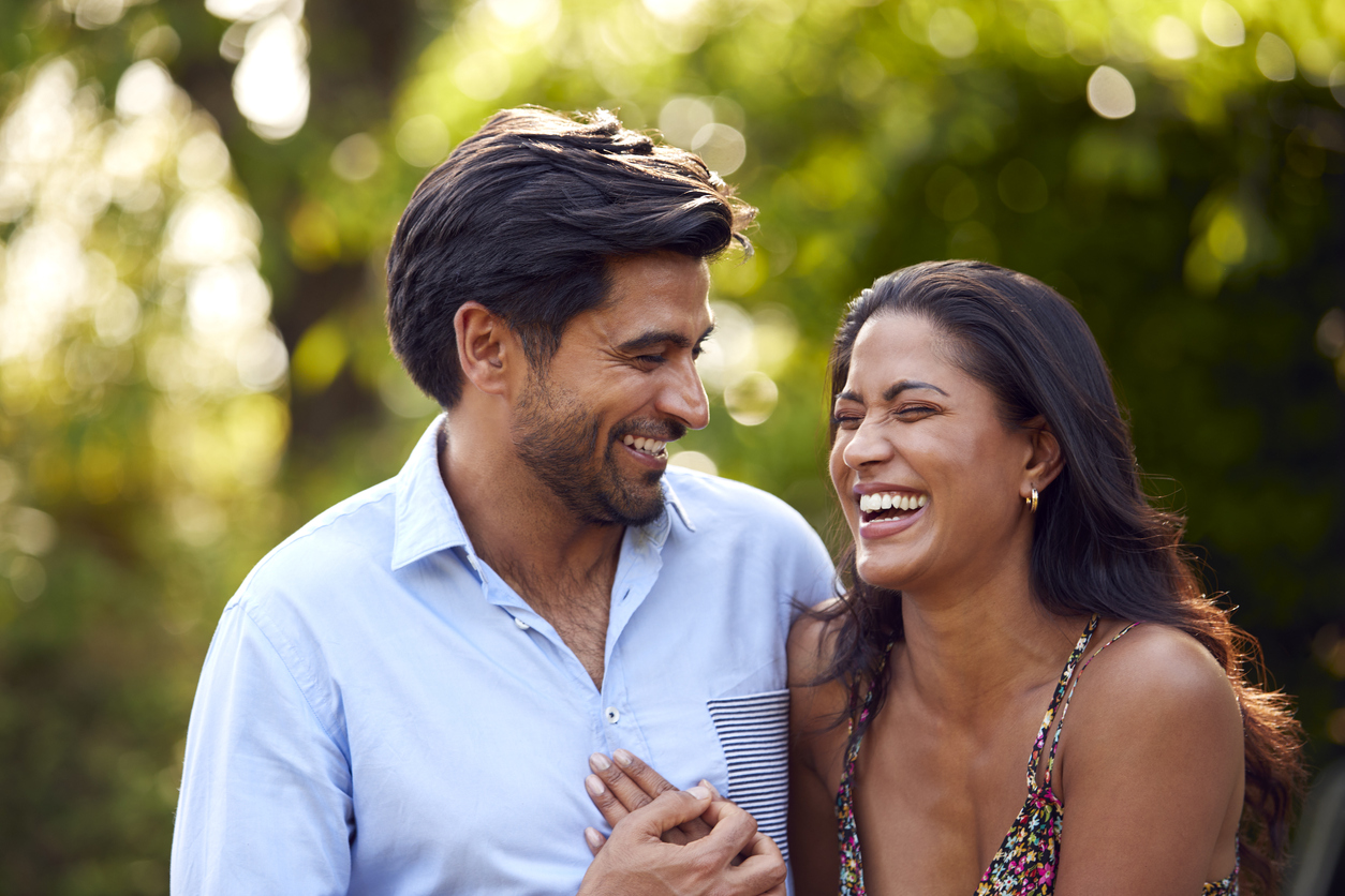 couple smiling and hugging