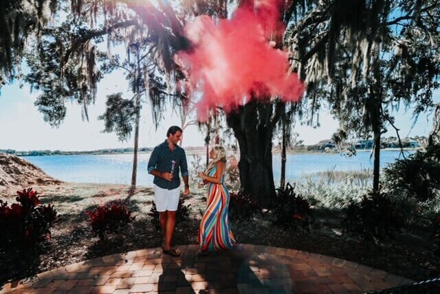 recording artist ashley j. and her husband outdoors near water