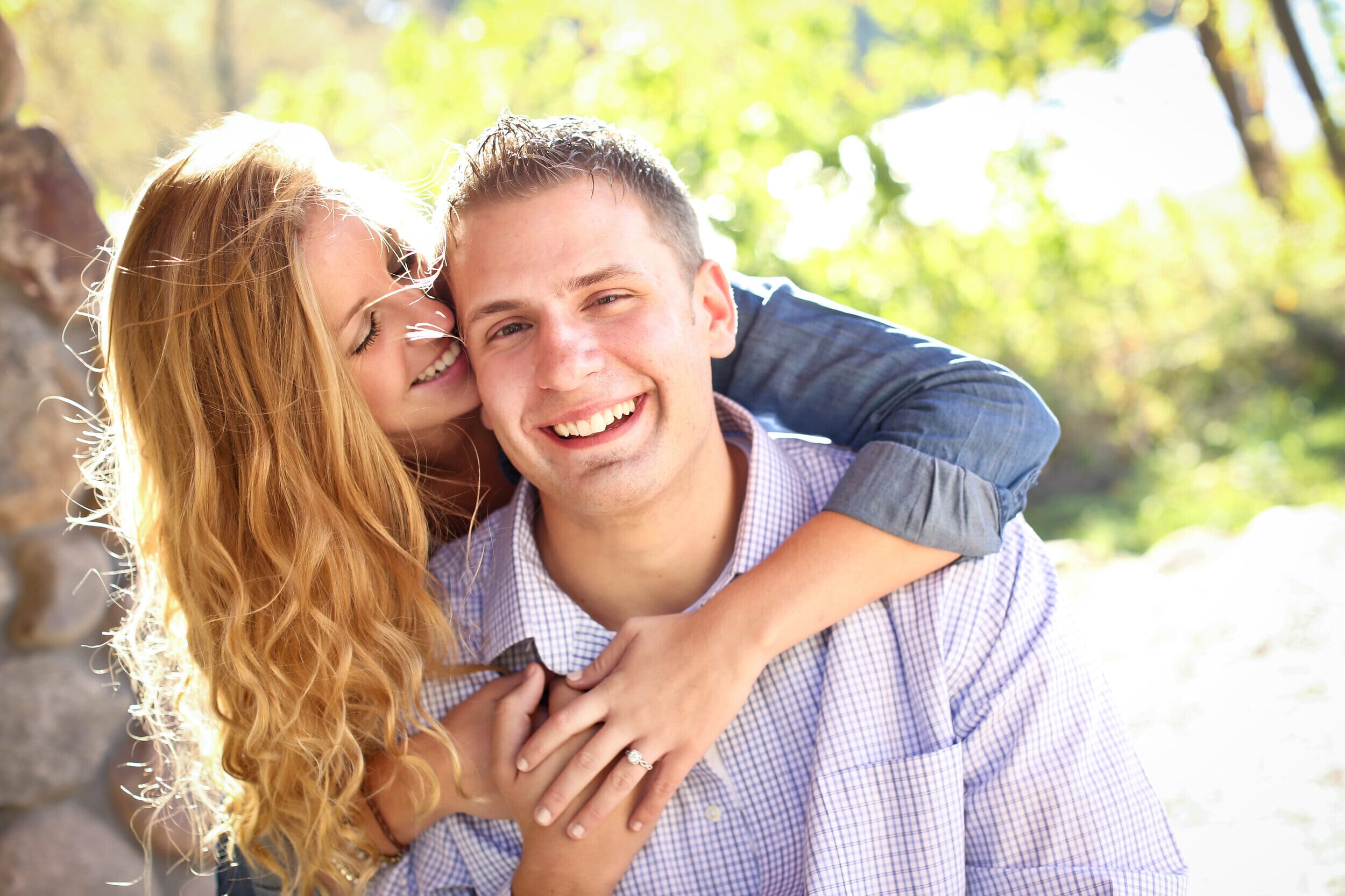 happy couple under a tree