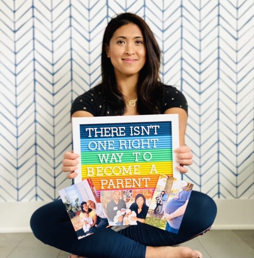 josephine alturi holding a sign that reads "there isn't one right way to become a parent"