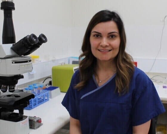 embryologist kristen jones at her desk