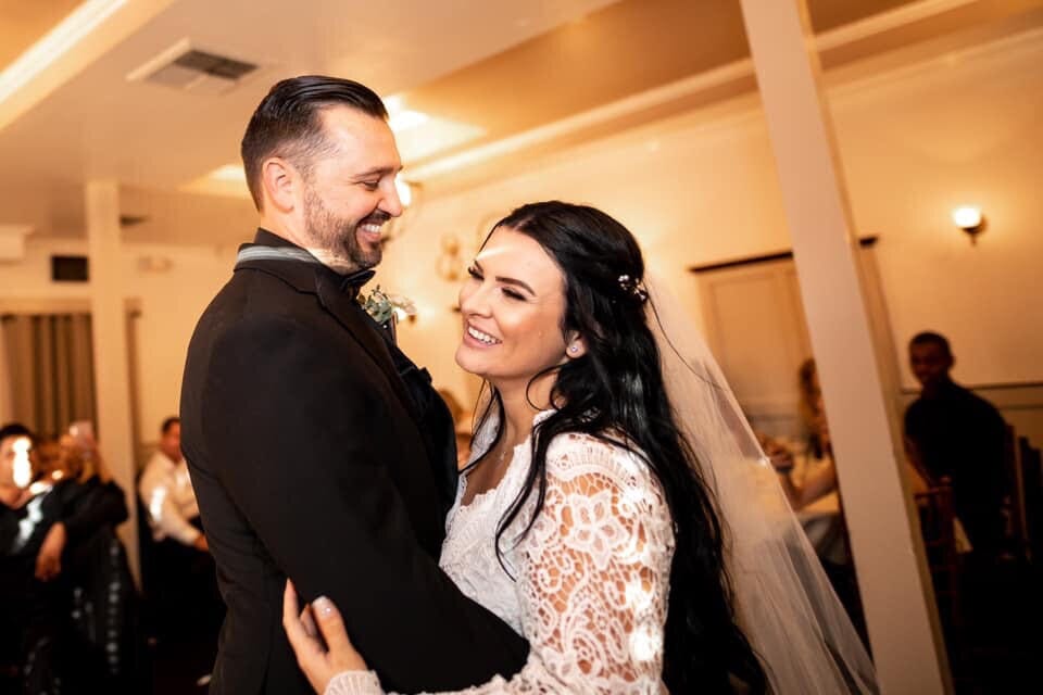 kaitlin mcfarland and her husband dancing at their wedding